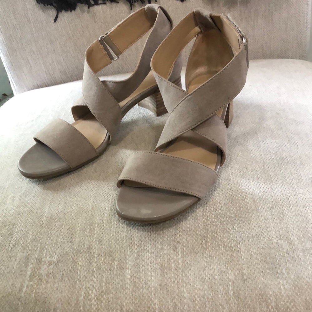 Naturalized size 6.5, tan suede, barely worn. Low, comfortable heel.